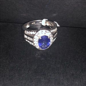 Beautiful Iolite center Stone sourronded by Zicon
